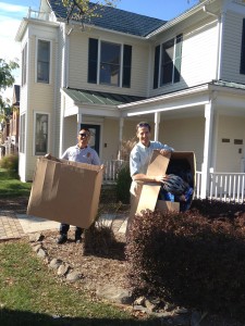 Prior to Hurricane Sandy, Fairfax County Bicycle Police Help Doug Landau load bike safety helmets back into the Herndon Virginia law firm's building police boxes to law shop