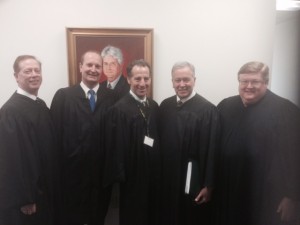 Landau, center, shown here with other panel judges at the William B. Spong Moot Court Invitational Tournament on February 13 -14, 2015.