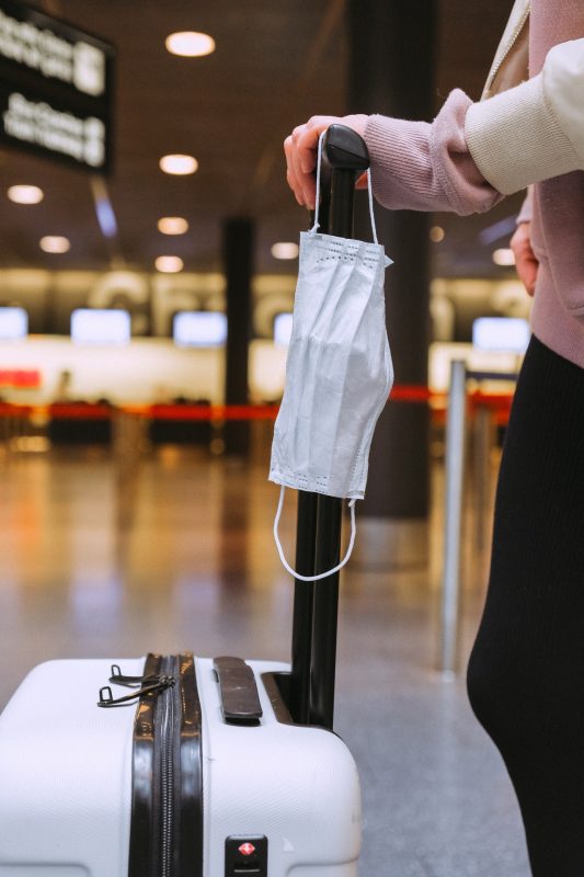 masks and luggage in airport