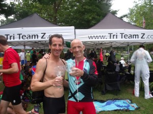 "Frazz" comic strip creator Jef Mallet and Doug Landau clink their crystal award glasses after the Luray Triathlon