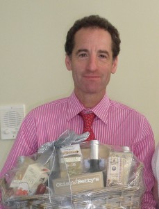 Herndon Reston Virginia spine and brain injury lawyer Doug Lanau with a gift basket from a thankful client