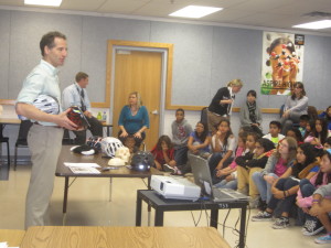 Herndon Virginia bicycle safety lawyer Doug Landau teaches Herndon sixth graders about preventing brain injury before giving each one their own new Bell bike helmet