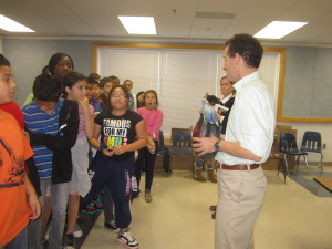 Virginia bike safety lawyer Doug Landau interacts with Herndon elementary school students who are about to be given free Bell bicycle helmets