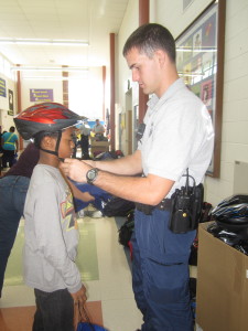 Police helped fit new helmets on Herndon Virginia sixth graders at two local Fairfax County Elementary Schools