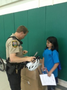 Local Police help with helmet distribution at Guilford Elementary School