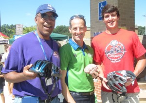 Race Director Chuck James, Herdon bike safety lawyer Doug Landau & former Triathlete turned Stanford University crew member Andrew Gyanis helping at the 2013 Reston Triathlon helmet inspection