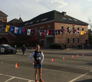 Doug Landau with the 50 state flags before the start of the Diane Burr Memorial road race in Thomaston, Connecticut