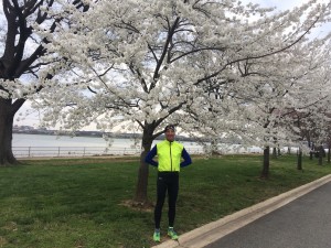 Despite the cold, Doug Landau admires the blossoms at Hains Point in Washington, DC, after finishing 6th in the annual Race for Equal Justice 5km put on by GWU Law Students