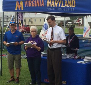 Race Director Greg Hawkins, the Mayor AND Vice Mayor of Rock Hall, MD and top triathlete medal-wearing Gail Waldman all help out at the awards ceremony !