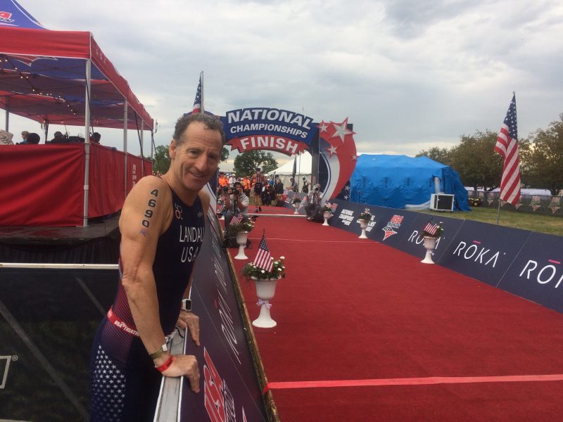 Herndon injury lawyer Doug Landau under stormy skies in Omaha, Nebraska, after finishing the 2017 USA Sprint Triathlon National Championship