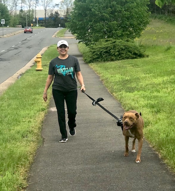 Beatriz walks her dog