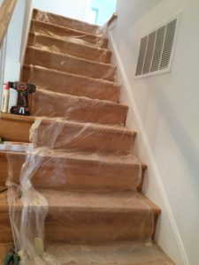 Would a fall from this staircase be compensable under Virginia law ? There are no hand rails, they are covered in plastic & there are other tripping hazards...