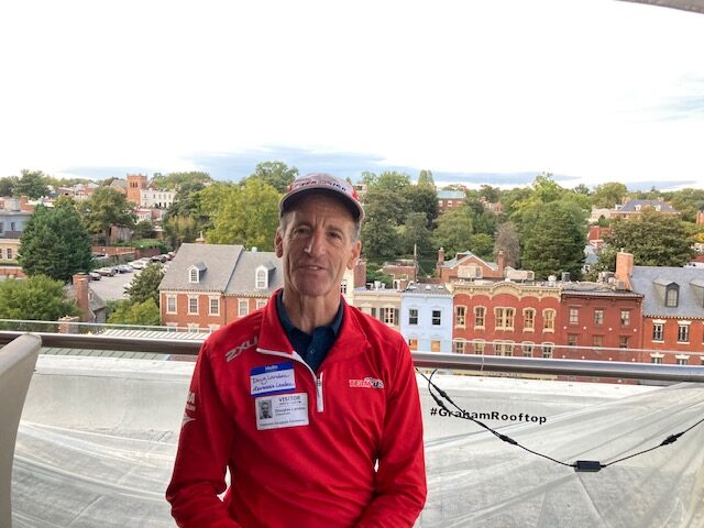 Virginia workers' comp attorney Doug Landau of Abrams Landau Ltd. standing on rooftop in Georgetown, at a recent DC Trial Lawyers Association meeting, where this I-66 corridor and Dulles Toll Road truck crash lawyer exchanged ideas with other top injury attorneys from Maryland, Virginia and the District of Columbia. Lawyer Landau routinely takes part in Continuing Legal Education programs to keep up with the latest legal trends, technology and trial tactics, in order to help his clients injured in crashes throughout the East Coast of the United States, who come to ABRAMS LANDAU, Ltd. from all over the country.