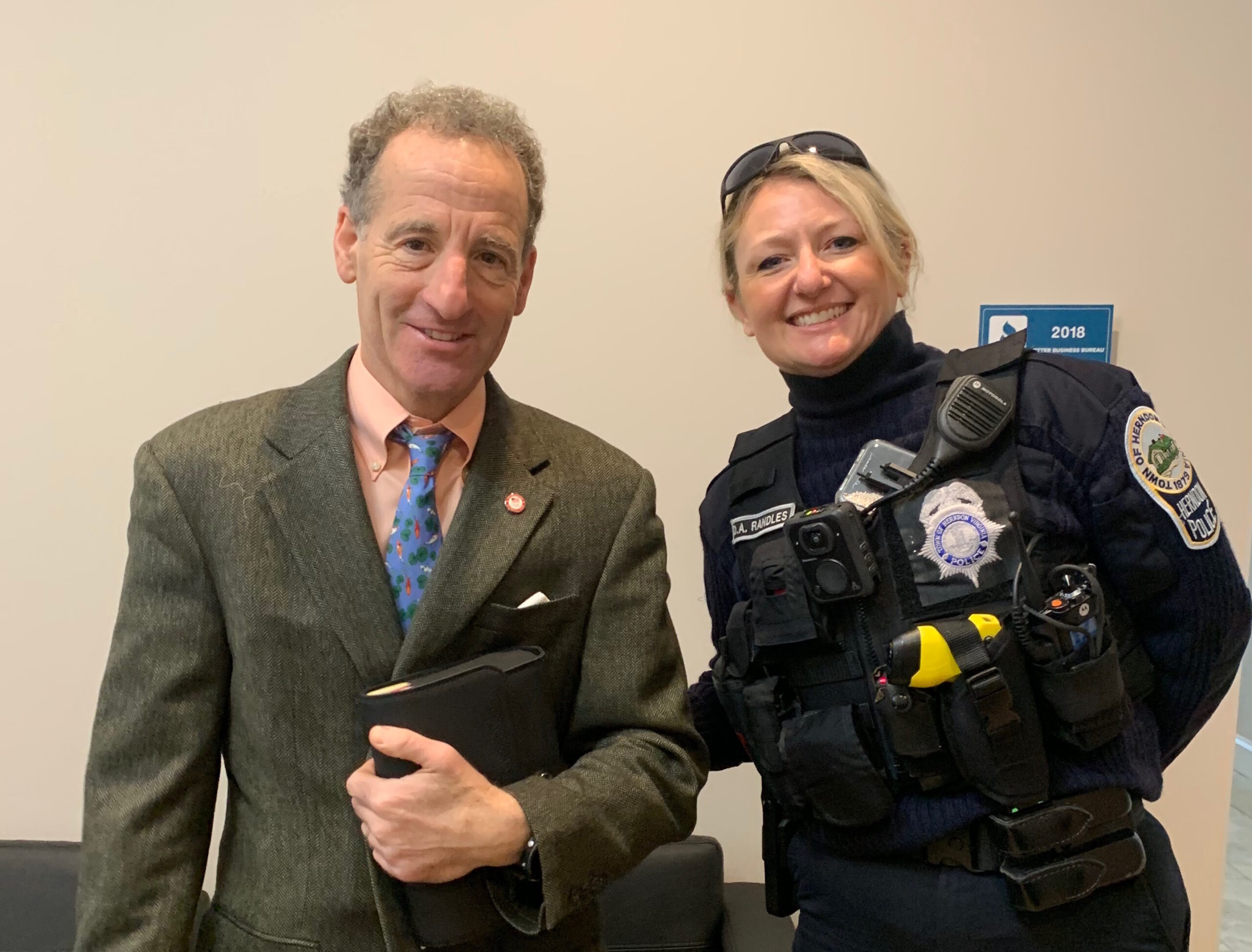 Attorney Doug Landau with a Herndon police officer