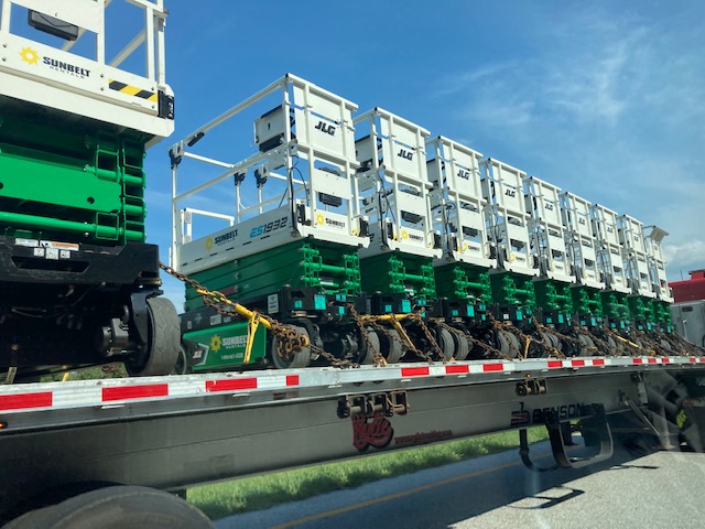 Row of scaffolding units loaded on flatbed trailer. If an employee's work injury is determined to have resulted from their willful violation of a safety rule, that injured worker may find that they cannot win their workers' compensation benefits claim.