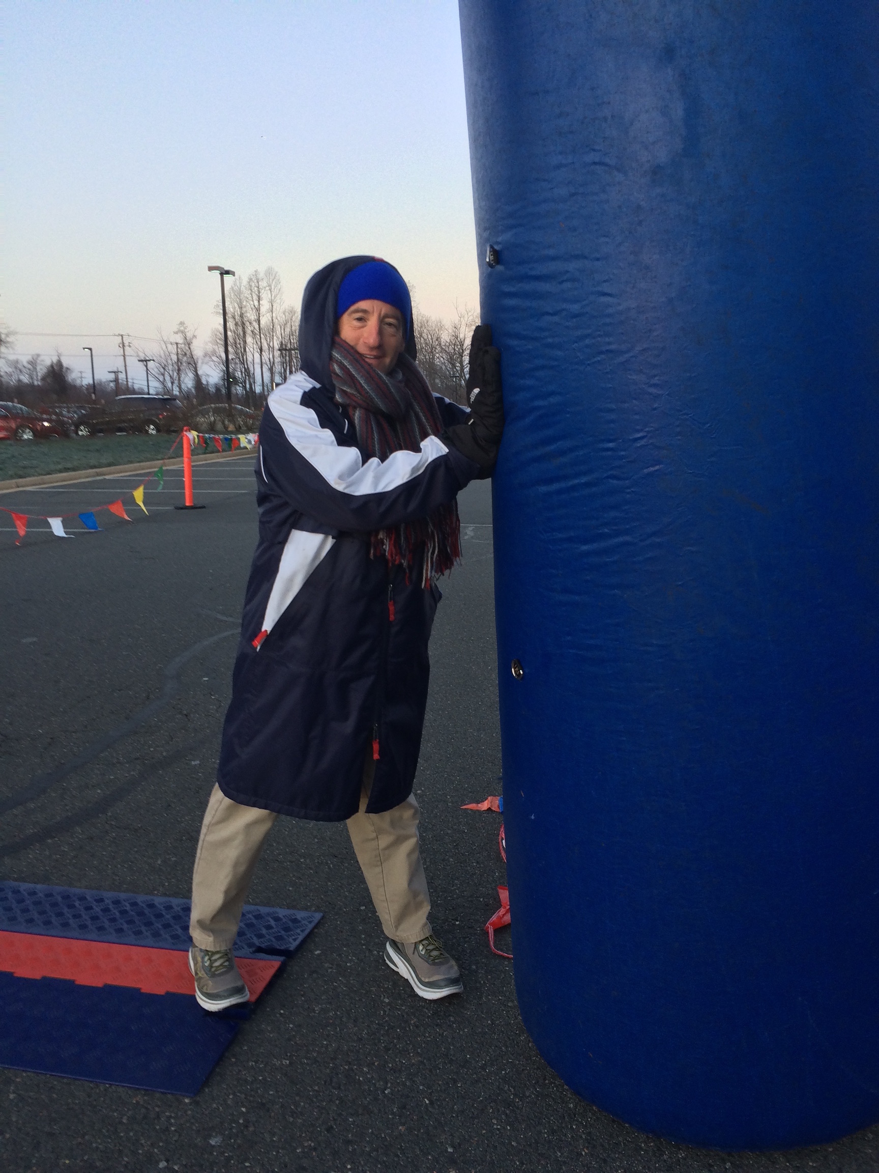 Race volunteer Doug Landau helping to secure the finish line at a wonderful event put on by the Bristow Virginia event support team