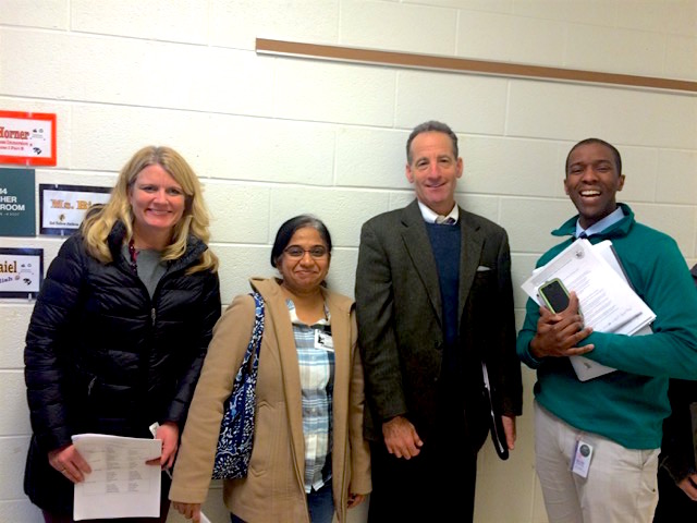 R-L, Principal Gordon Stokes with Herndon lawyer Doug Landau and parent volunteers after coaching a "We the People" class at Rachel Carson Middle School