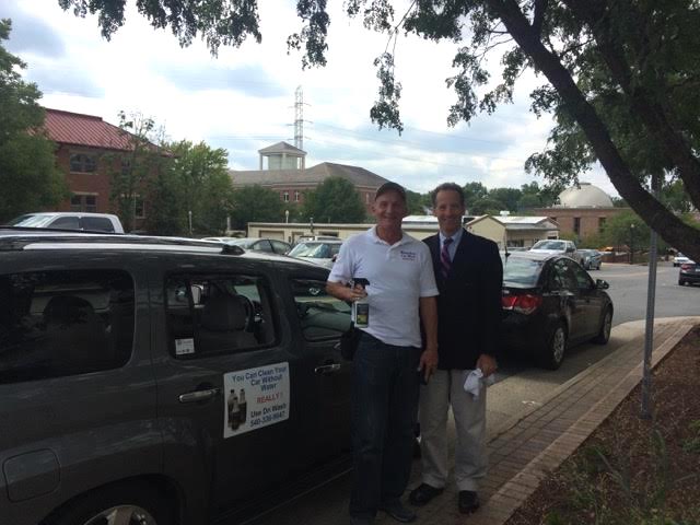 Mr. K and Lawyer Doug Landau pose next to the Abrams Landau office in Herndon, VA.